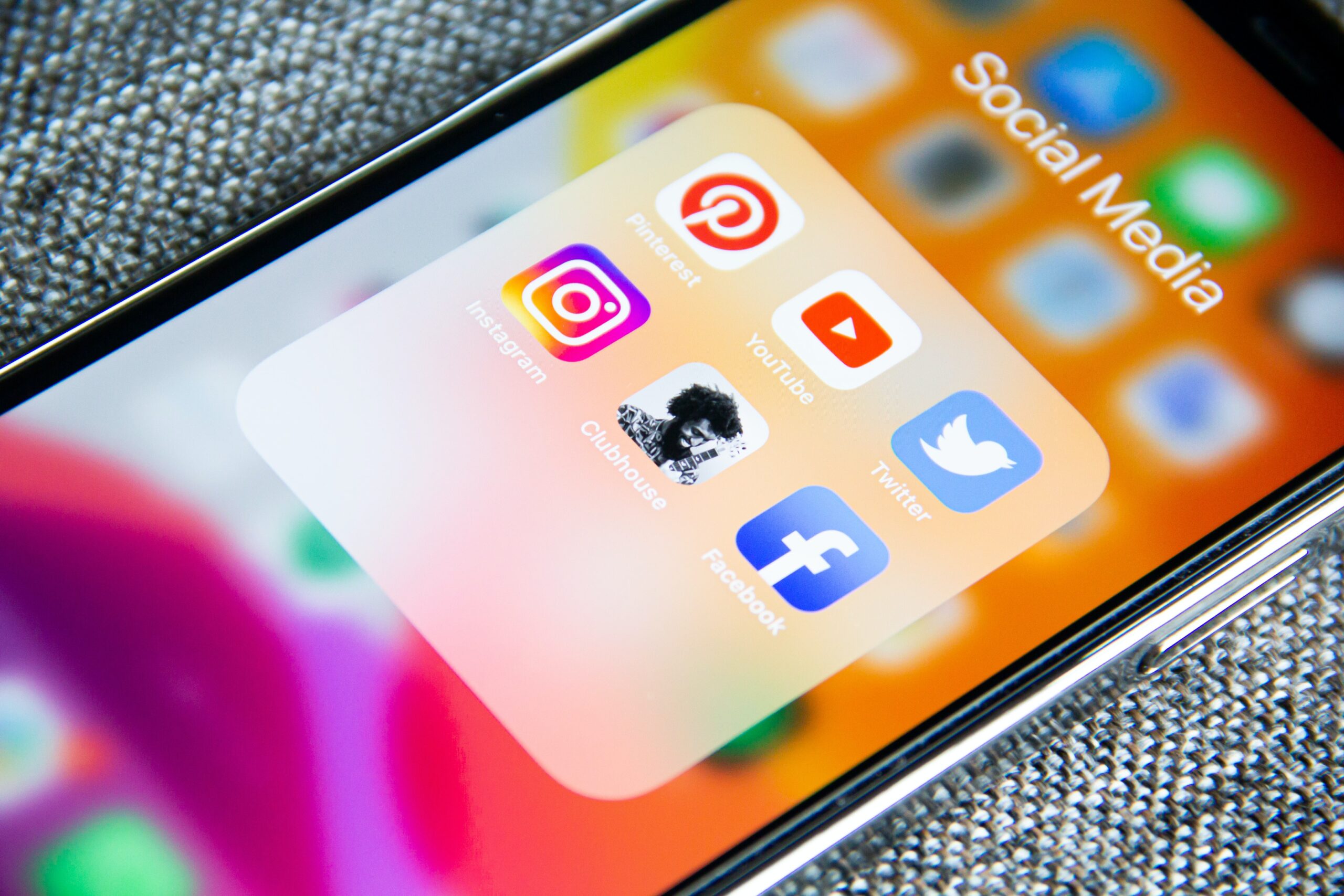 a mobile phone displaying pinterest, youtube, twitter, facebook, instagram apps